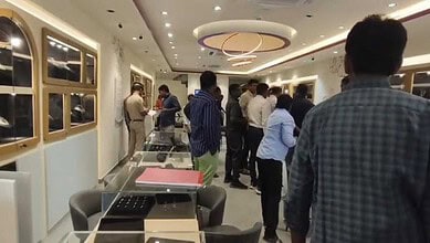 Customers browsing jewellery inside CaratLane store in Medipally.