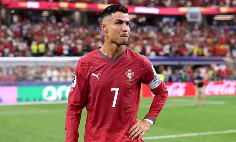 Portuguese footballer Cristiano Ronaldo in Portugal national team jersey on the field.
