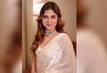 Farrhana Bhatt in a white saree with jewelry at Hyderabad event, during her appearance.
