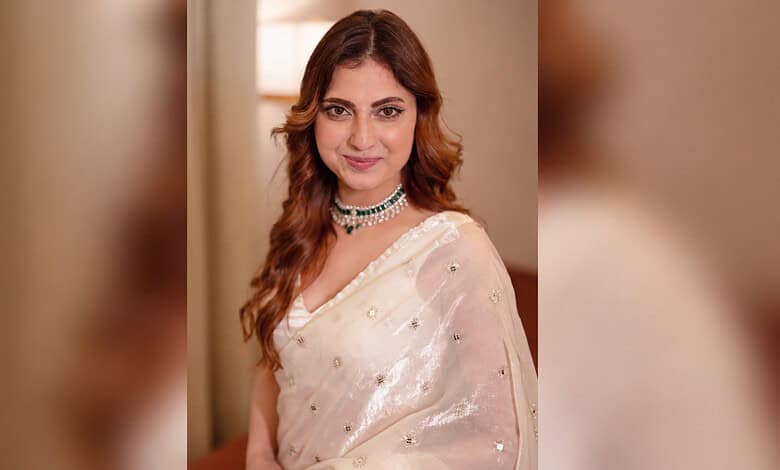 Farrhana Bhatt in a white saree with jewelry at Hyderabad event, during her appearance.