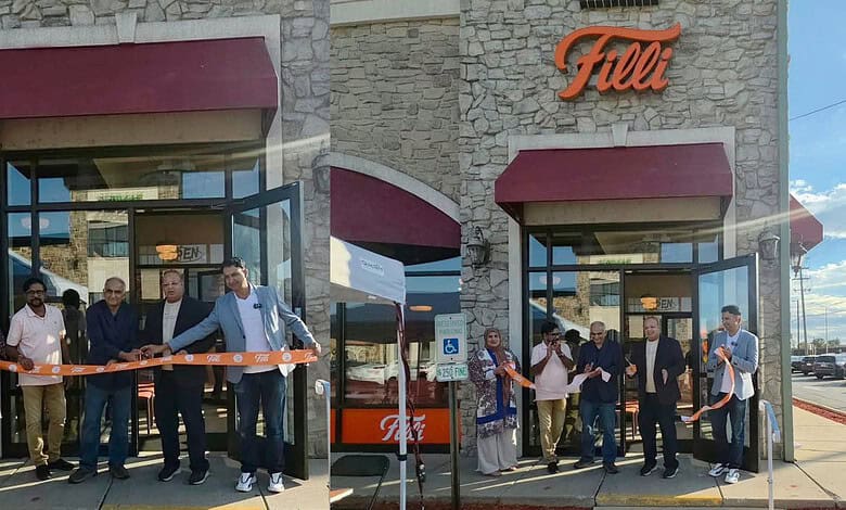 Grand opening of a retail store with people cutting a ribbon outside the store.