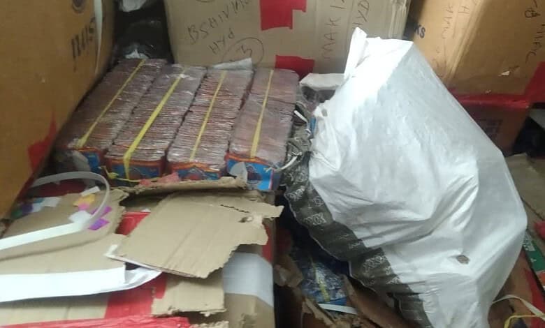 Seized firecrackers and packaging materials in a storage area before Diwali.