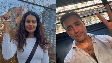 Payal Rohatagi and Imran Khan pose for selfies outdoors in casual attire.