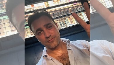 Actor Imran Khan making a peace sign during a public appearance in Mumbai.