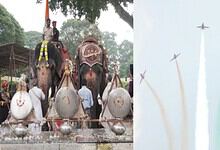 Elephants decorated for a festival with people and colorful ornaments in India.