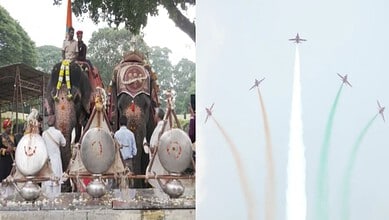 Elephants decorated for a festival with people and colorful ornaments in India.