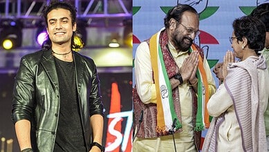 Jubin Nautiyal performing on stage with a microphone in hand, wearing a black leather jacket.