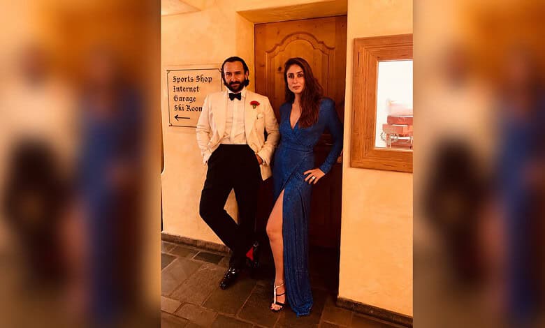 Saif Ali Khan and Kareena Kapoor at an event, dressed elegantly in blue and white.