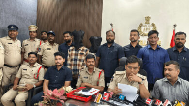 Police officers and suspects during a press conference in Rangareddy district.
