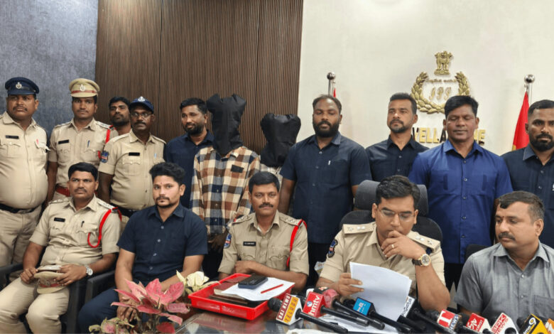Police officers and suspects during a press conference in Rangareddy district.