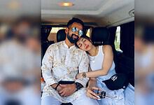 Malaika Arora and Sarvesh sitting together in a car, Malaika resting her head on his shoulder.