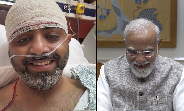 Indian man in hospital bed with nasal oxygen tube, smiling, after medical treatment.