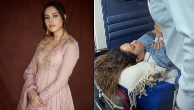 Nushrratt Bharuccha lying on hospital stretcher after Bali accident, receiving medical attention.