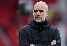 Ex-Man City boss Pep Guardiola in a thoughtful pose during a match or training session.