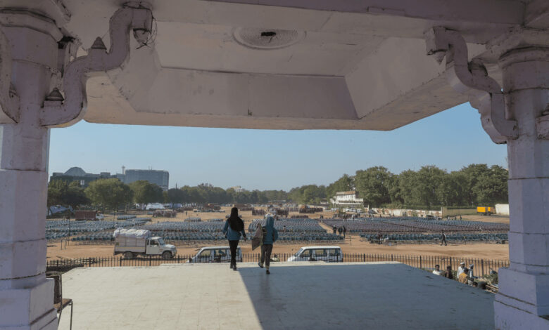 View of Ramlila Maidan from a pavilion with two people standing and looking out.