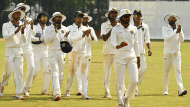 Hyderabad cricket team players celebrating during a match at the Ranji Trophy.