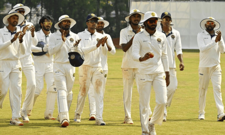 Hyderabad cricket team players celebrating during a match at the Ranji Trophy.