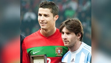 Cristiano Ronaldo and Lionel Messi together, celebrating football achievements.