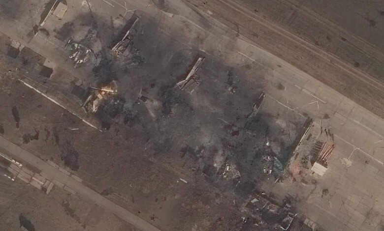 Aerial view of damaged buildings and smoke after an attack on a Russian oil refinery.
