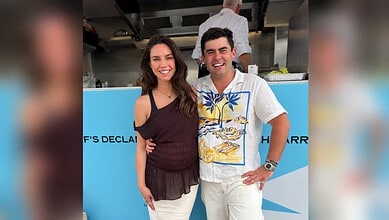 Sarah Todd and Declan Cleary smiling together at a social gathering.
