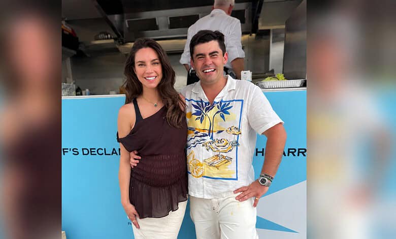 Sarah Todd and Declan Cleary smiling together at a social gathering.