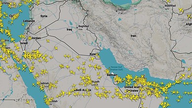 Numerous aircraft flying over Middle East and Gulf region, indicating busy airspace.