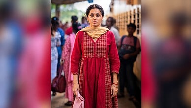 Taapsee Pannu in a red traditional dress at a public event in India.