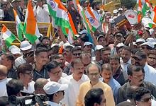 Large crowd of protesters with Indian flags during rally against CEC in Mumbai.