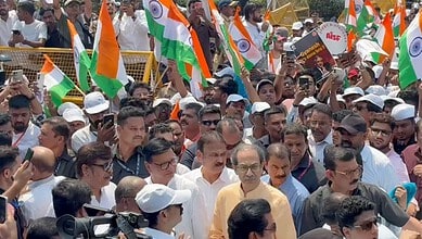 Large crowd of protesters with Indian flags during rally against CEC in Mumbai.