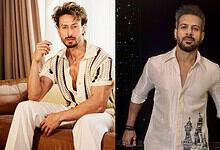 Karanveer Mehra reacts to Tiger Shroff firing incident, wearing a cream shirt and standing outdoors.