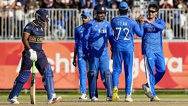 Indian cricket players celebrating during a match against Sri Lanka at the Asian Games.