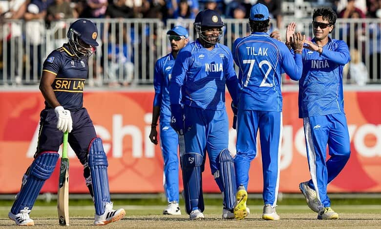 Indian cricket players celebrating during a match against Sri Lanka at the Asian Games.