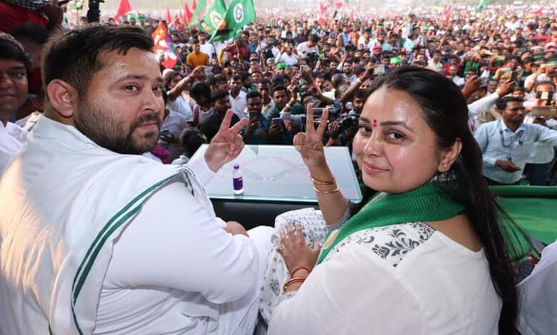 Lalu's daughter and Tejashwi at a political rally with a large crowd in the background.