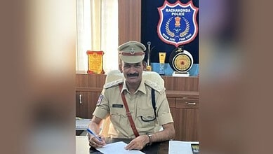Telangana police officer in uniform at Rachakonda Police station office.