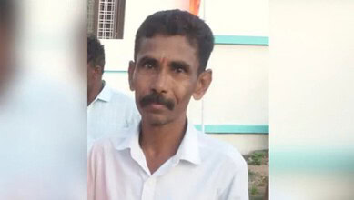 Nizamabad man who self-immolated, dies during treatment, in a white shirt.