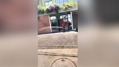 Staff member of Anaganaga Hotel cleans the premises