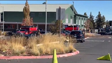 Police officers cordon off school in Oregon after shooting incident