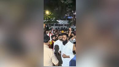 Crowd gathered at Dandiya event in Hyderabad's Begumpet, with some people raising hands and engaging in a.