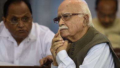 Veteran BJP leader LK Advani in a thoughtful pose during a meeting or event.