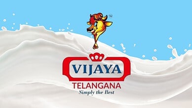 Vijaya Telangana milk logo with splash of milk in background.