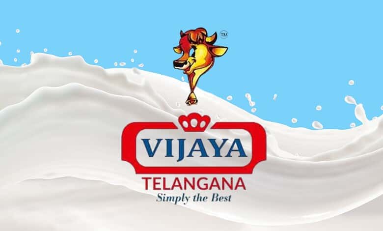Vijaya Telangana milk logo with splash of milk in background.