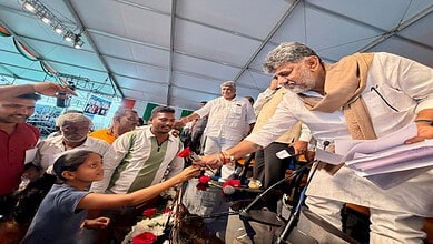 Chief Minister DK Shivakumar interacts with citizens at praja seva event.