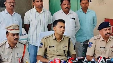 Police officers and civilians during a press conference in India.