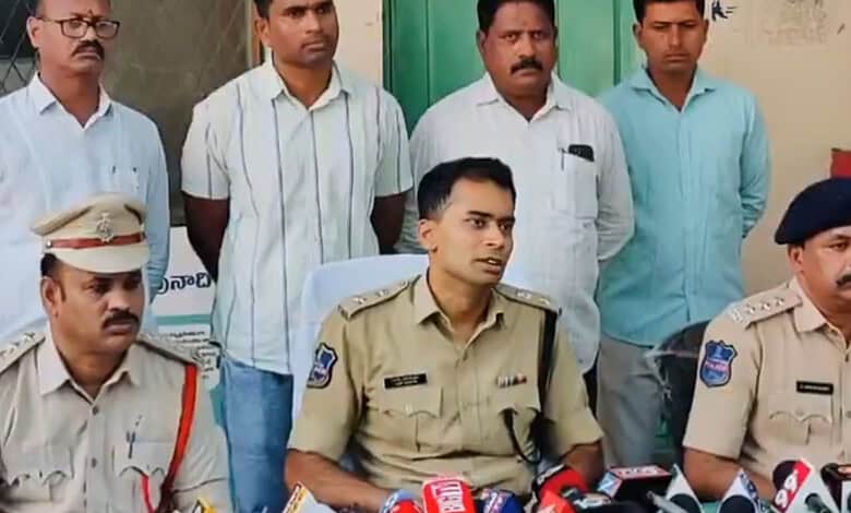 Police officers and civilians during a press conference in India.