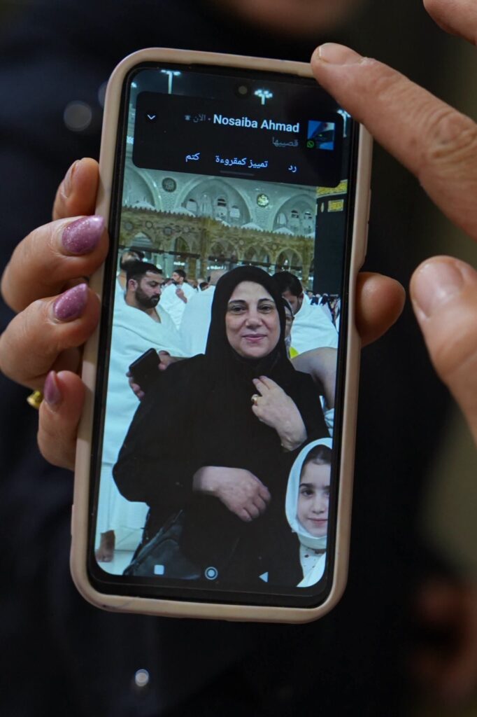 Photo of Syrian mother of four Buthaina Ahmad Oweida displayed on a mobile phone.