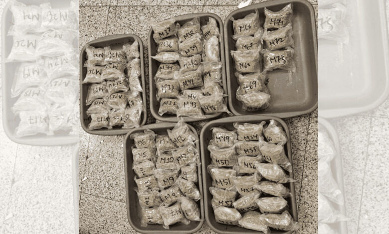 Multiple packages of seized cannabis with handwritten labels in plastic bags at RGI Airport.