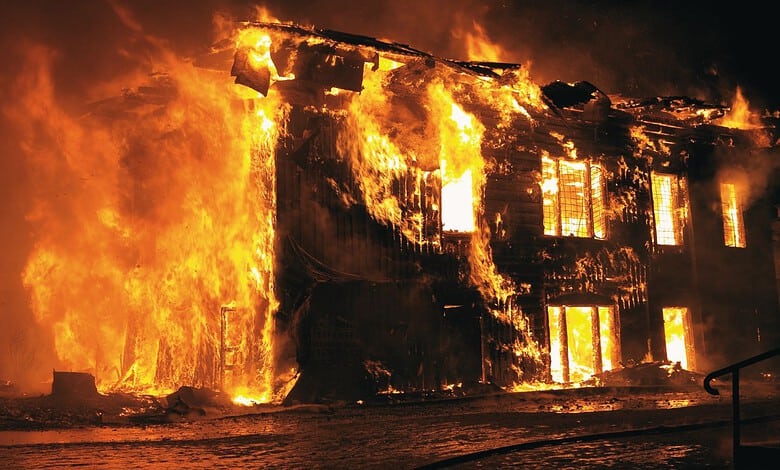 Building on fire with flames and smoke during a fire emergency.