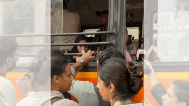 Women in hijabs being segregated and forced onto a bus by police in Delhi.