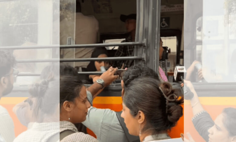 Women in hijabs being segregated and forced onto a bus by police in Delhi.