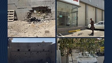Debris from missile attack damages buildings and vehicles in Saudi Arabia.